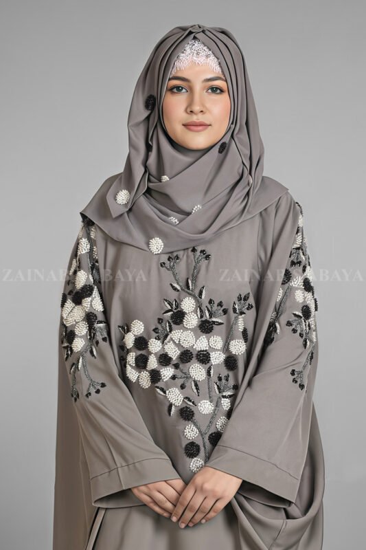 Nida Kaftan Abaya for women in Pakistan with Stone Detailing specifically designed for weddings and formal party wear. It comes with a matching scarf in chiffon fabric with same stone detailing.