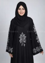 Black Embroidered Umbrella Abaya for women in Pakistan which is crafted with premium Nida Korean Fabric at cheap price as well as a matching scarf in chiffon fabric.