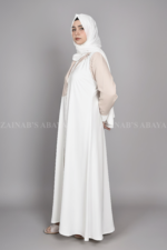 Nida Coat Style Abaya for women in Pakistan which is crafted with Premium Nida Korean Fabric with a matching scarf in chiffon fabric.