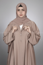 Nida Coat Style Abaya for Women in Pakistan with Button Style on Front and Sleeves as well as a matching scarf in chiffon fabric.