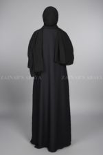 Black Coat Style Abaya for women in Pakistan is crafted with Premium Nida Korean Fabric