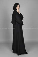 Black Coat Style Abaya for women in Pakistan is crafted with Premium Nida Korean Fabric and button style sleeves.