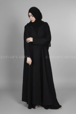Black Coat Style Abaya for women in Pakistan is crafted with Premium Nida Korean Fabric & Button Style Sleeves.