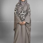 Nida Kaftan Abaya for women in Pakistan with Stone Detailing specifically designed for weddings and formal party wear. It comes with a matching scarf in chiffon fabric with same stone detailing.