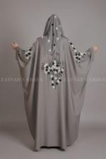 Nida Kaftan Abaya for women in Pakistan with Stone Detailing specifically designed for weddings and formal party wear. It comes with a matching scarf in chiffon fabric with same stone detailing.