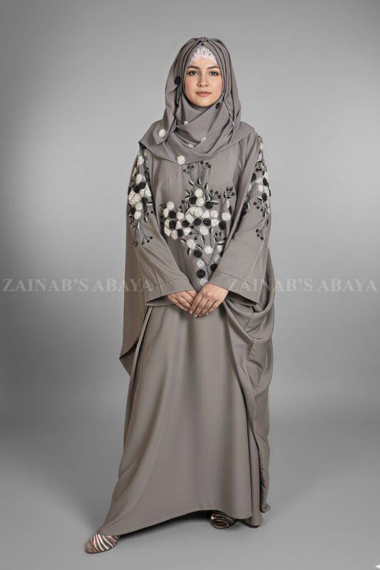 Nida Kaftan Abaya for women in Pakistan with Stone Detailing specifically designed for weddings and formal party wear. It comes with a matching scarf in chiffon fabric with same stone detailing.