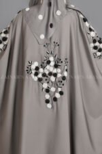 Nida Kaftan Abaya for women in Pakistan with Stone Detailing specifically designed for weddings and formal party wear. It comes with a matching scarf in chiffon fabric with same stone detailing.