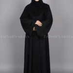 Black Front Open Abaya for women in Pakistan which is crafted with Premium Nida Korean Fabric at cheap price with a matching scarf in chiffon fabric.