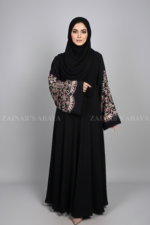 Nida Umbrella Abaya for women in Pakistan at cheap price featuring the arabic embroidery includes a matching scarf in chiffon fabric.