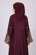 Nida Embroidered Front Open Abaya for women in Pakistan features embroidery on front and sleeves and comes with a matching scarf.