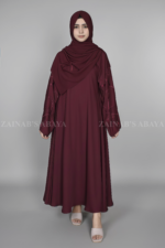 Nida Maxi Abaya for women in Pakistan with Stylish embroidered sleeves and a matching scarf.