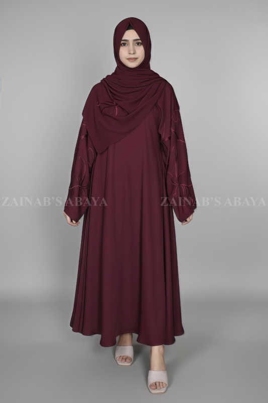 Nida Maxi Abaya for women in Pakistan with Stylish embroidered sleeves and a matching scarf.