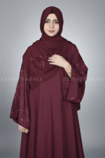 Nida Maxi Abaya for women in Pakistan features the stylish embroidered sleeves and a matching scarf.