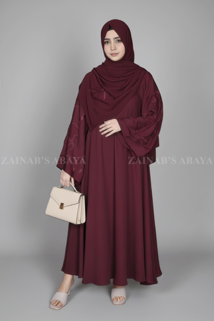 Nida Maxi Abaya for women in Pakistan with stylish embroidered sleeves and a matching scarf.