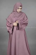 Nida Kasni Colored Front Open Abaya for women in Pakistan with embroidered sleeves as well as a matching scarf.