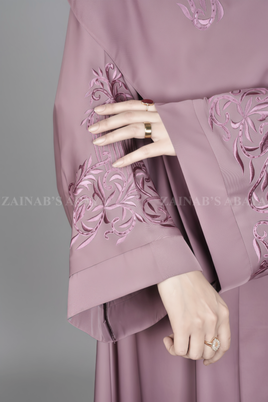 Nida Kasni Colored Front Open Abaya for women in Pakistan with embroidered sleeves as well as a matching scarf.