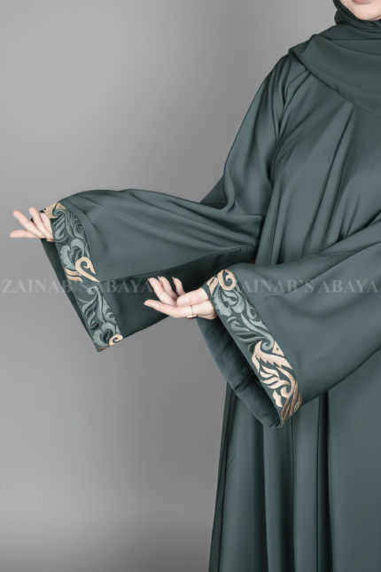 Nida Umbrella Abaya for women in Pakistan features embroidery and comes with a matching scarf in chiffon fabric.