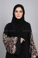 Nida Umbrella Abaya for women in Pakistan featuring the arabic embroidery includes a matching scarf in chiffon fabric.