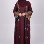 Nida Embroidered Front Open Abaya for women in Pakistan features embroidery on front and sleeves and comes with a matching scarf.
