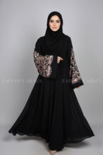 Nida Umbrella Abaya for women in Pakistan featuring the elegant arabic embroidery includes a matching scarf in chiffon fabric.