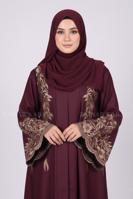 Nida Embroidered Front Open Abaya for women in Pakistan features embroidery on front and sleeves and comes with a matching scarf.