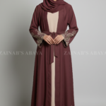 Nida Double Front Open Gown Abaya for women in Pakistan features embroidery on front back and sleeves or it comes with a matching scarf in chiffon fabric.
