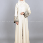 Nida Gown Abaya for women in Pakistan with stylish embroidered sleeves and a matching scarf in chiffon fabric.