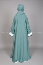 Nida Coat Style Abaya with inner for women in Pakistan featuring the button style on front, smart coat style collar and comes with a matching scarf in chiffon fabric.