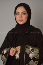 Nida Umbrella Abaya for women in Pakistan with stylish embroidery comes with a matching scarf in chiffon fabric.