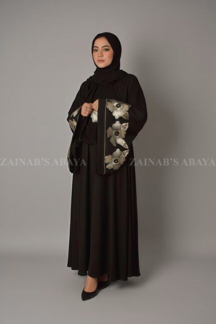 Nida Umbrella Abaya for women in Pakistan with stylish embroidery comes with a matching scarf in chiffon fabric.
