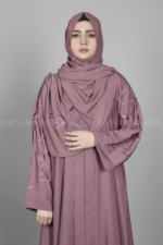 Nida Front Open Abaya for women in Pakistan features the stylish embroidered sleeves and a matching scarf in chiffon fabric.