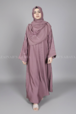 Nida Front Open Abaya for women in Pakistan features the stylish embroidered sleeves and a matching scarf in chiffon fabric.