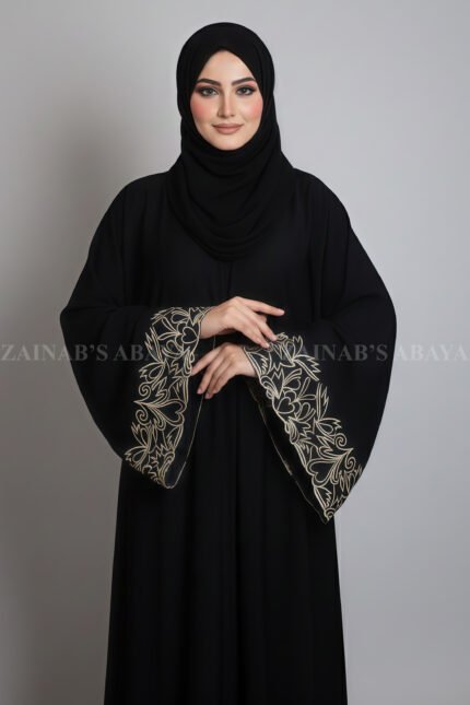 Nida Umbrella Abaya for women in Pakistan featuring the elegant embroidery on sleeves and comes with a matching scarf in chiffon fabric