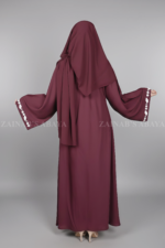 Nida Umbrella Abaya for women in Pakistan in Front open style features embroidery and comes with a matching scarf in chiffon fabric.