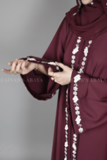 Nida Umbrella Abaya for women in Pakistan in Front open style features embroidery and comes with a matching scarf in chiffon fabric.