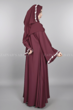 Nida Umbrella Abaya for women in Pakistan in Front open style features embroidery and comes with a matching scarf in chiffon fabric.