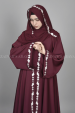 Nida Umbrella Abaya for women in Pakistan in Front open style features embroidery and comes with a matching scarf in chiffon fabric.