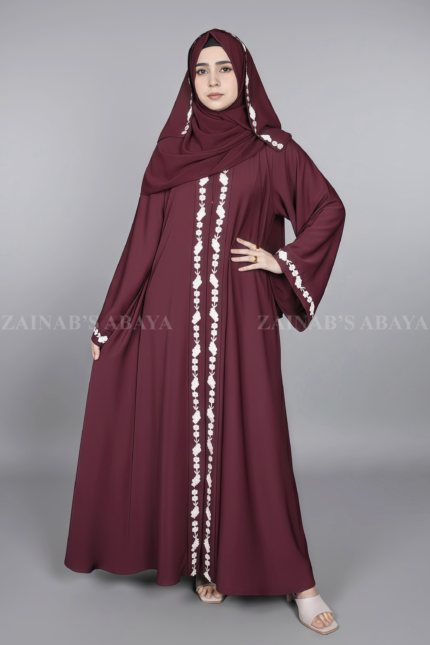 Nida Umbrella Abaya for women in Pakistan in Front open style features embroidery and comes with a matching scarf in chiffon fabric.