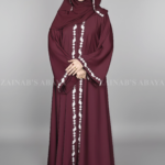 Nida Umbrella Abaya for women in Pakistan in Front open style features embroidery and comes with a matching scarf in chiffon fabric.