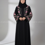 Nida Black Maxi Abaya for women in Pakistan featuring embroidery on front both sides or sleeves comes with a matching scarf in chiffon fabric.