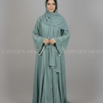 Nida Front Open Abaya for women in Pakistan with Piping on Front and Sleeves and a matching scarf.