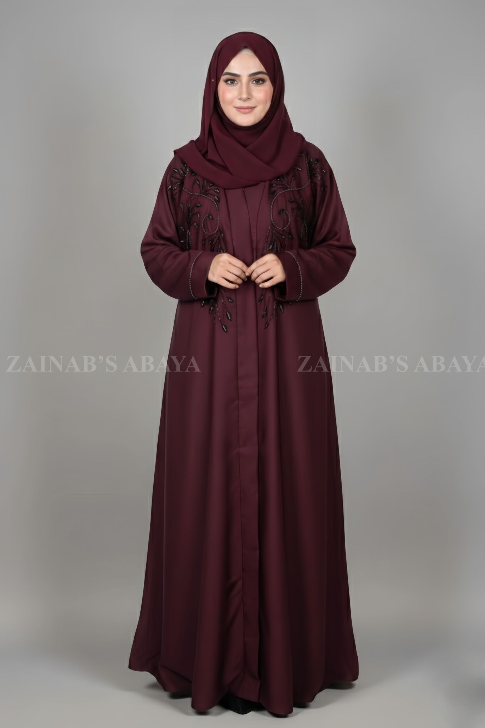 Front Open Abaya Nida front open abaya with intricate Zardozi work, offering a luxurious and elegant design.
