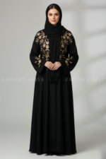 Nida Front Open Abaya for women in Pakistan with Embroidery on Front and Sleeves as well as a matching scarf in chiffon fabric.