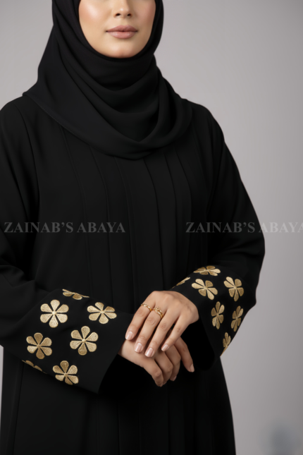 Nida Black Maxi Abaya for women in Pakistan with Embroidered Sleeves as well as a matching scarf in chiffon fabric.