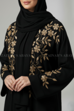 Nida Black Front Open Abaya for women in Pakistan with Embroidery on Front and Sleeve Cuffs with a matching scarf in chiffon fabric.