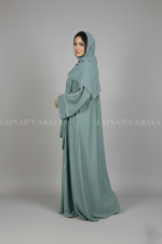 Nida Front Open Abaya for women in Pakistan with Piping on Front and Sleeves and a matching scarf.