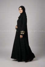 Nida Black Max Abaya for women in Pakistan with embroidered sleeves or a matching scarf in chiffon fabric.