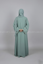 Nida Front Open Abaya for women in Pakistan with Piping on Front and Sleeves and a matching scarf.