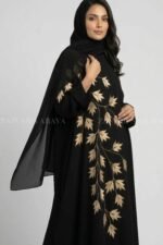 Nida Black Kaftan Abaya for women in Pakistan with Embroidery and a matching scarf in Chiffon Fabric.
