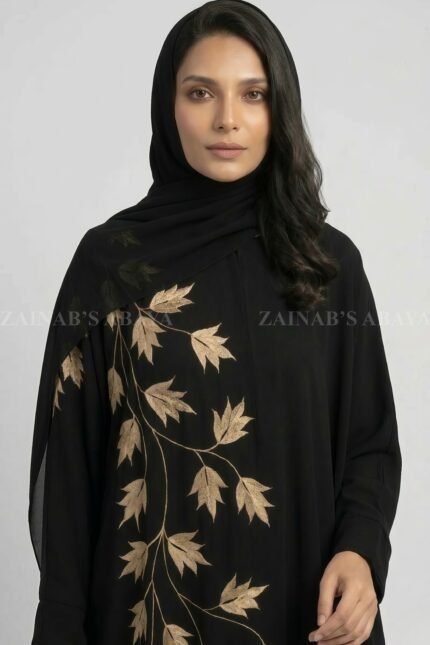Nida Black Kaftan Abaya for women in Pakistan with Embroidery and a matching scarf in Chiffon Fabric.